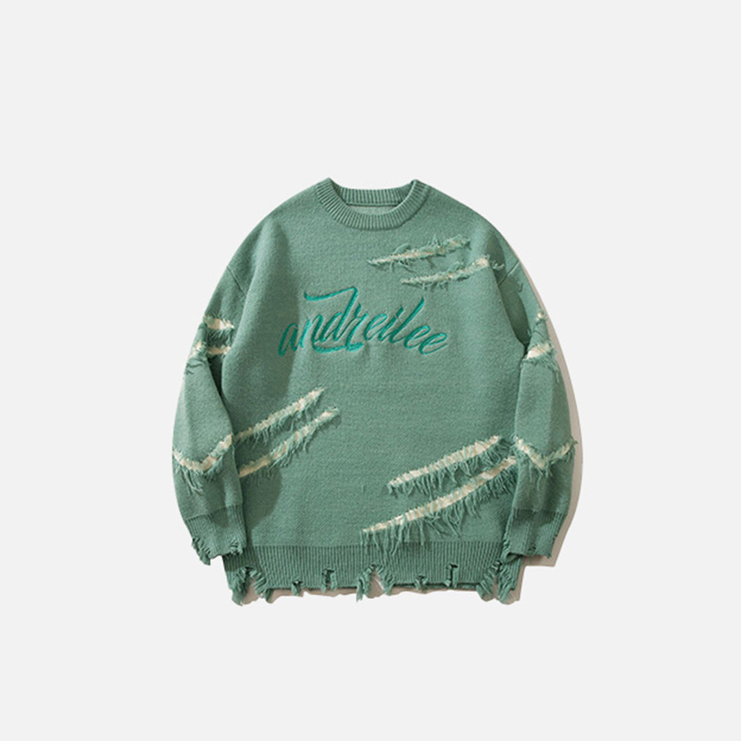 Front view of the green Ripped Artisan Sweater in a gray background