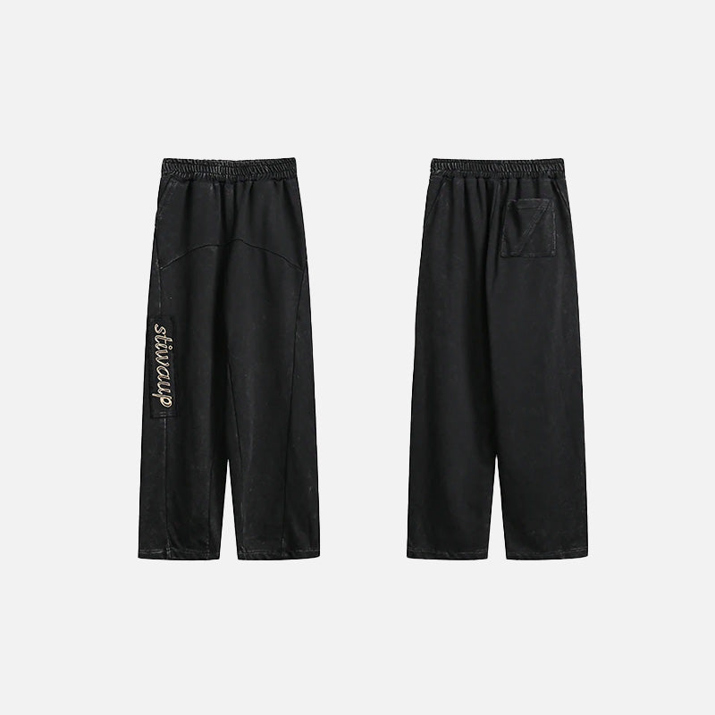 Front & Back view of the black Y2k Vintage Baggy Jeans in a gray background