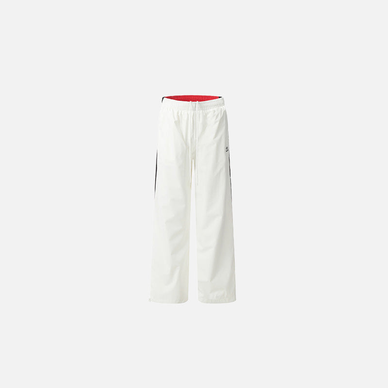 Front view of the white Classic Relaxed Fit Pants in a gray background