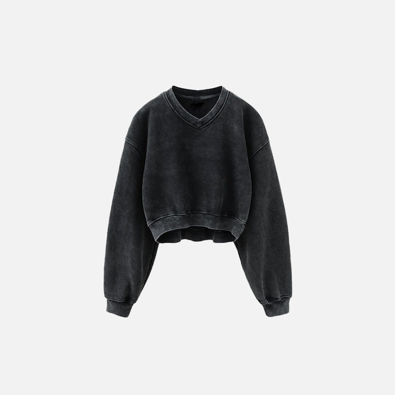 Front view of the black Women's Fleece Cropped Sweatshirt in a gray background