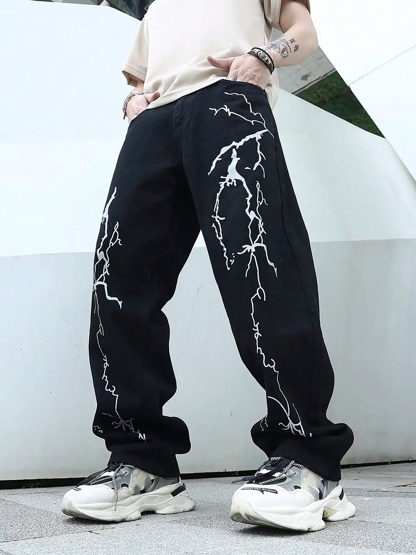 Model wearing the black Y2K Thunderbolt Denim Jeans