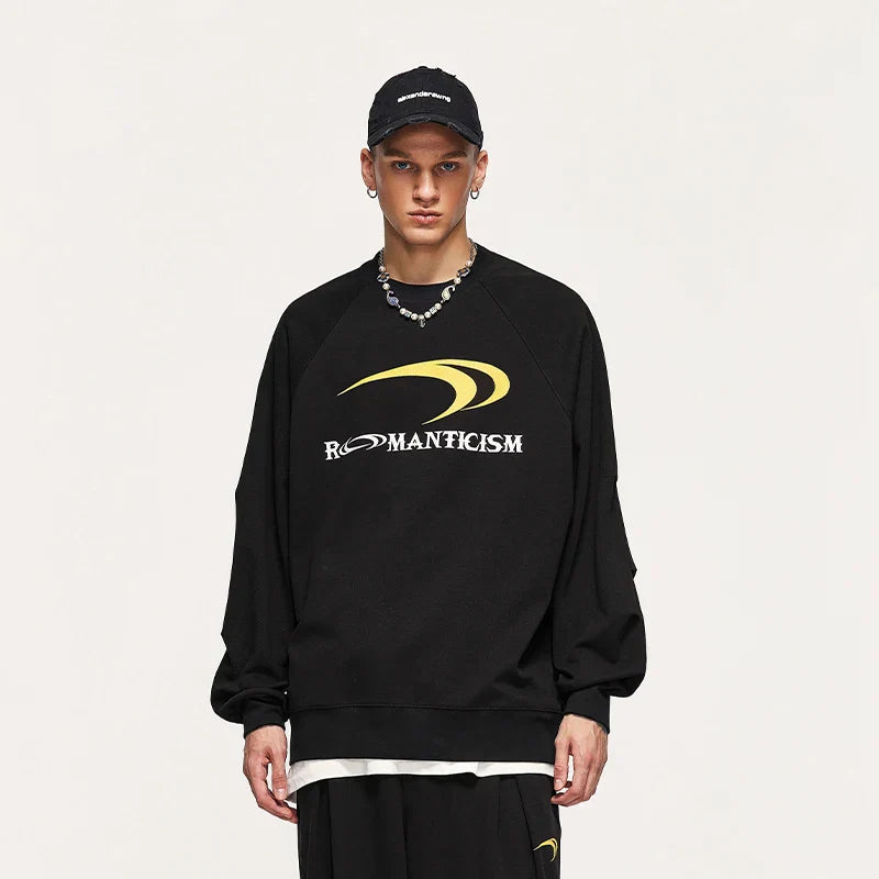 Model wearing the black Modern Romanticism Sweatshirt in a gray background