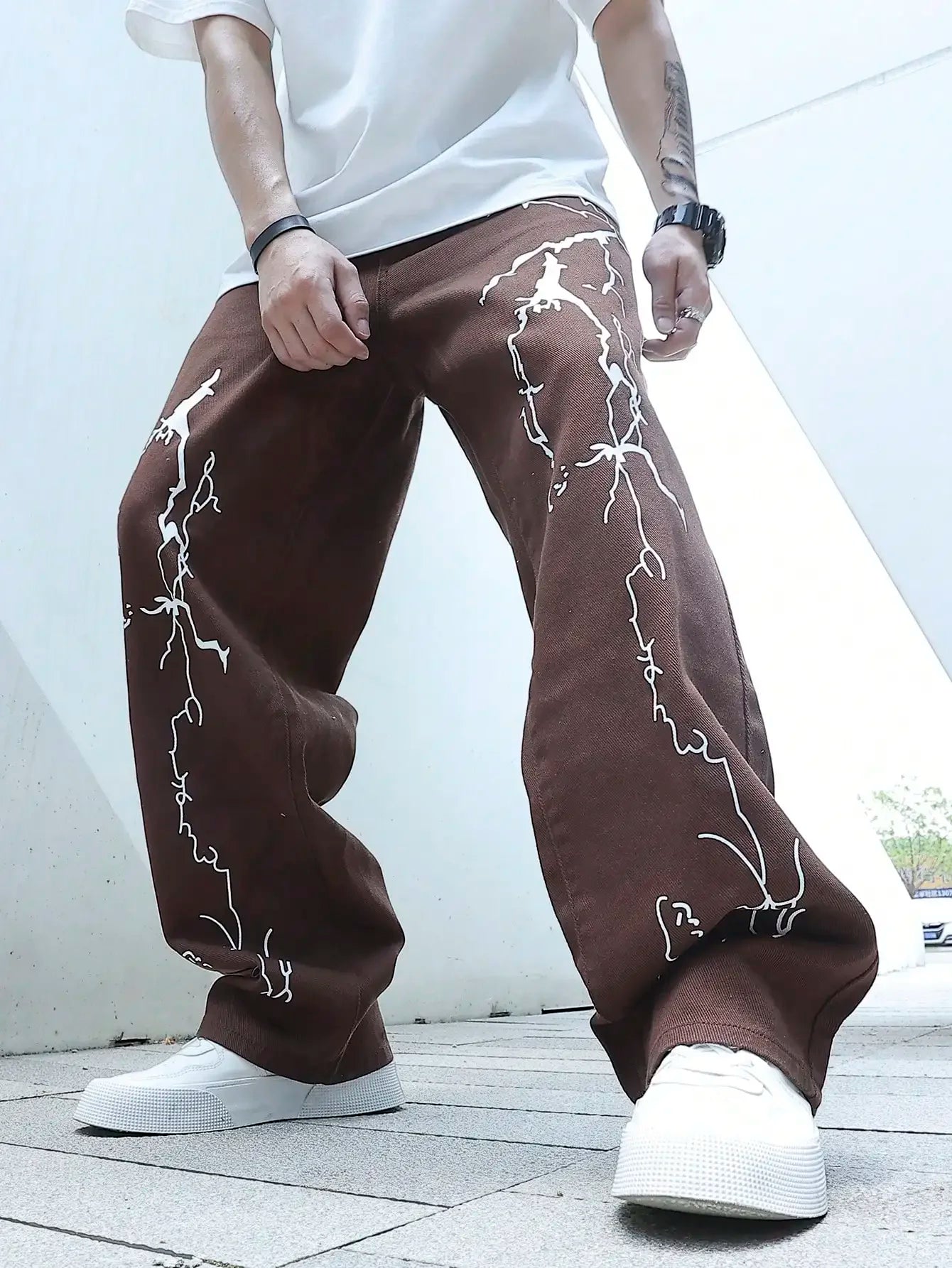 Model wearing the coffee Y2K Thunderbolt Denim Jeans