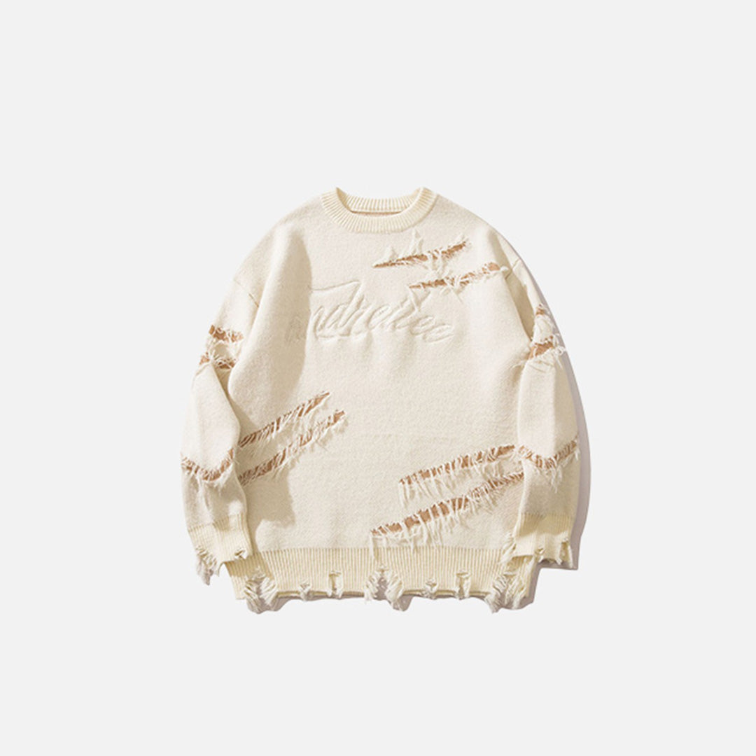 Front view of the apricot Ripped Artisan Sweater in a gray background