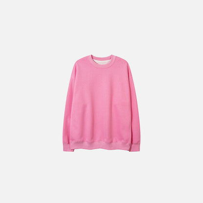 Front view of the pink Classic Crewneck Sweater in a gray background