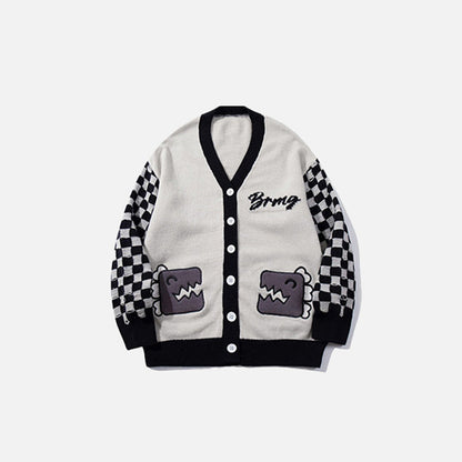 Front view of the pink Checkered Graphic Knit Sweater in a gray background
