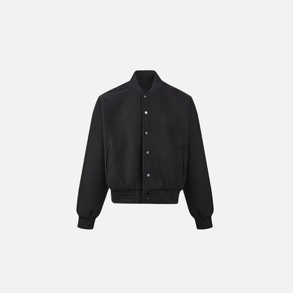 Front view of the black Urban Whisper Jacket in a gray background
