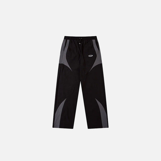 Front view of the black Vintage Black Patchwork Pants in a gray background