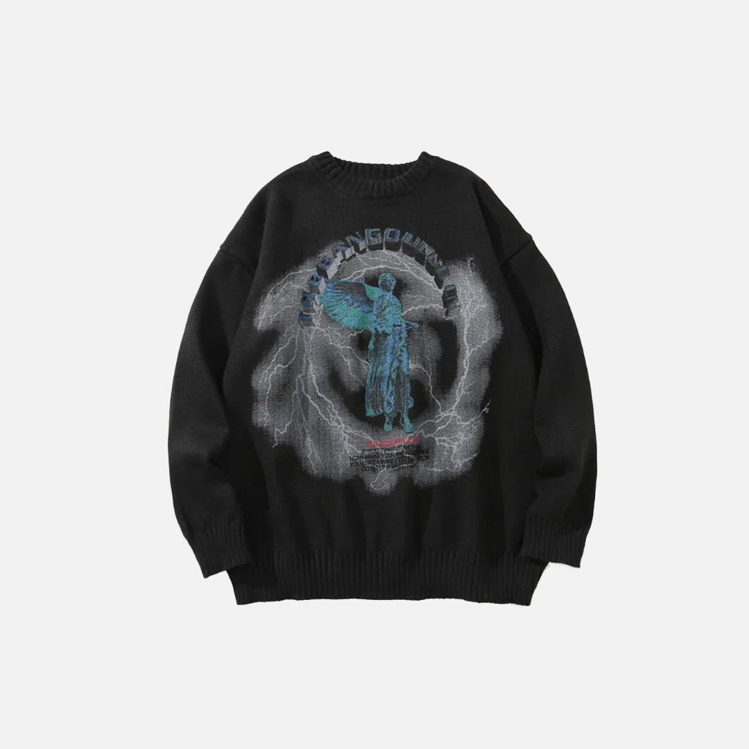 Front view of the black Angel Graphic Sweater of the gray bckground 