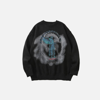 Front view of the black Angel Graphic Sweater of the gray bckground 