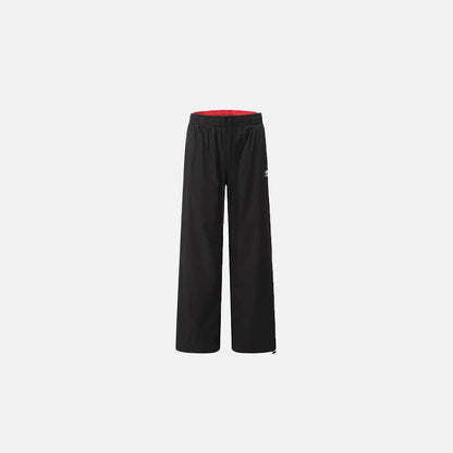 Front view of the black Classic Relaxed Fit Pants in a gray background