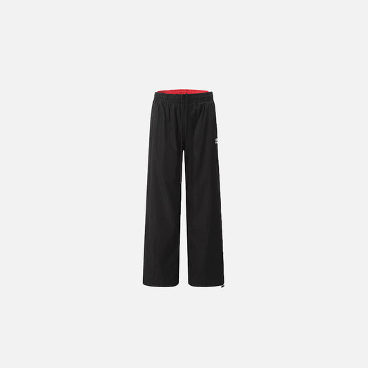 Front view of the black Classic Relaxed Fit Pants in a gray background