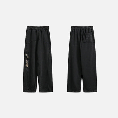 Front & Back view of the black Y2k Vintage Baggy Jeans in a gray background