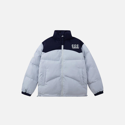 Front view of the blue Iconic Winter Puffer Jacket in a gray background
