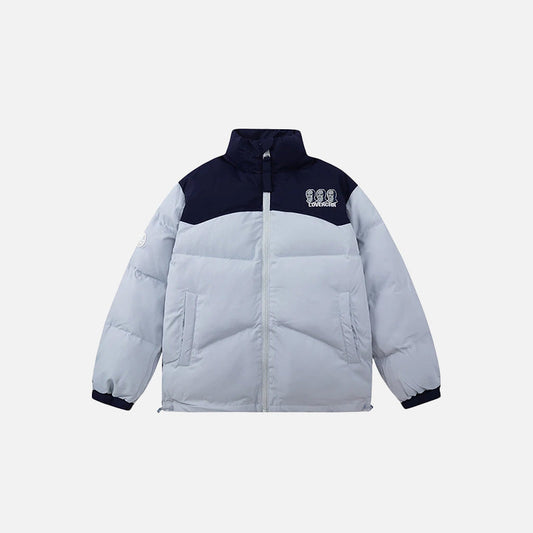 Front view of the blue Iconic Winter Puffer Jacket in a gray background