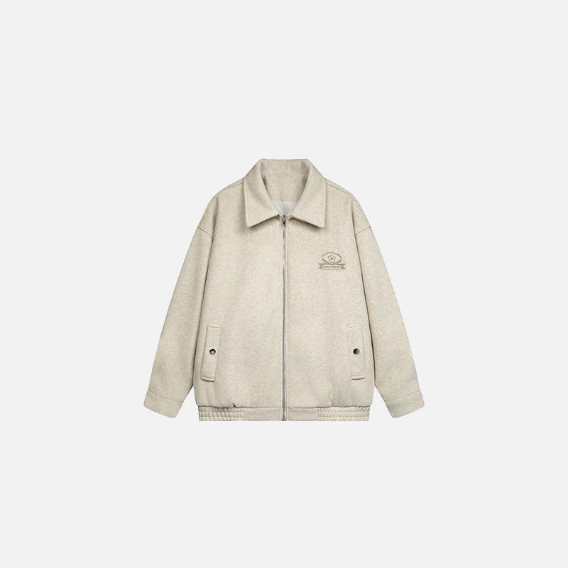 Front view of the apricot Classic Zip-Up Jacket in a gray background