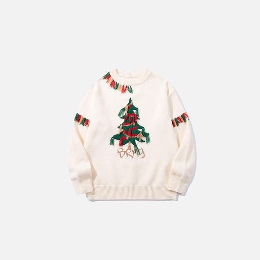 Front view of the beige Fringe Forest Sweater in a gray background