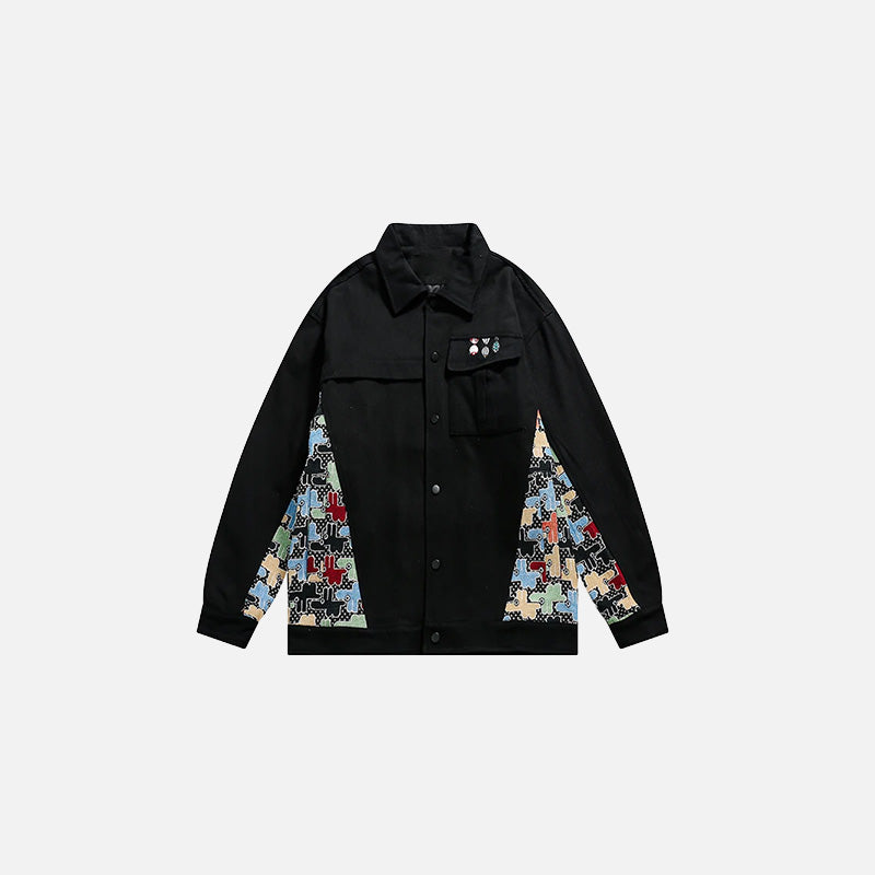 Front view of the black Patchwork Pop Jacket in a gray background